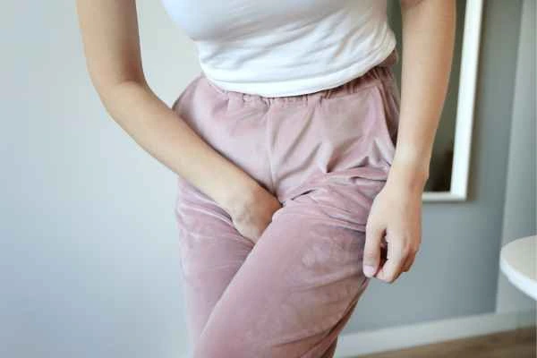 woman running for the toilet because of urinary incontinence Owsestry